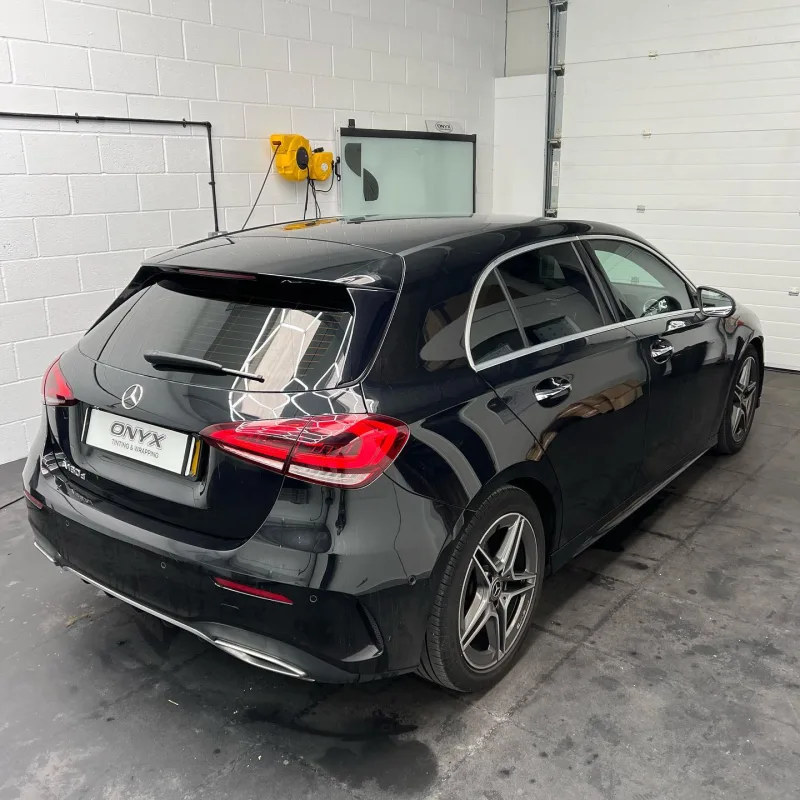Black Mercedes-Benz A-Class hatchback with 15% rear window tint