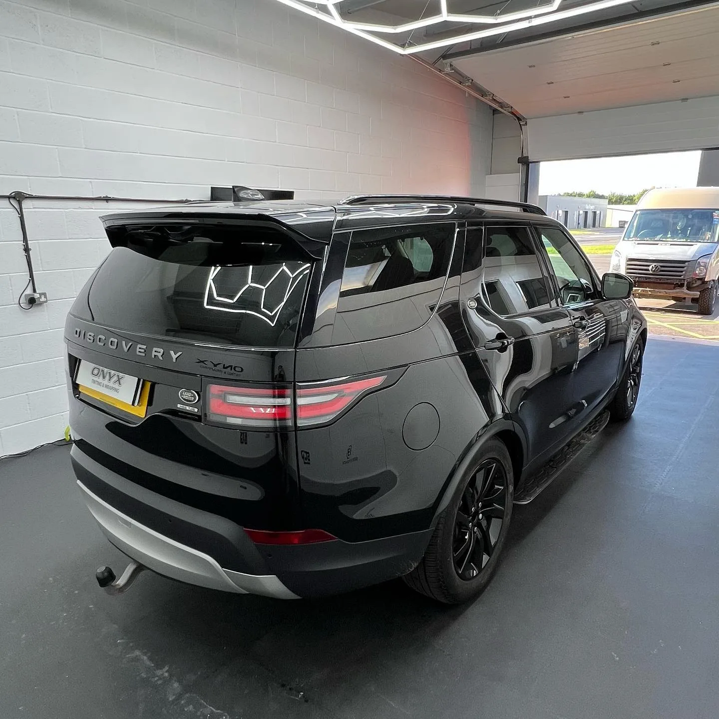 Black Land Rover Discovery Sport with 15% tinted rear windows
