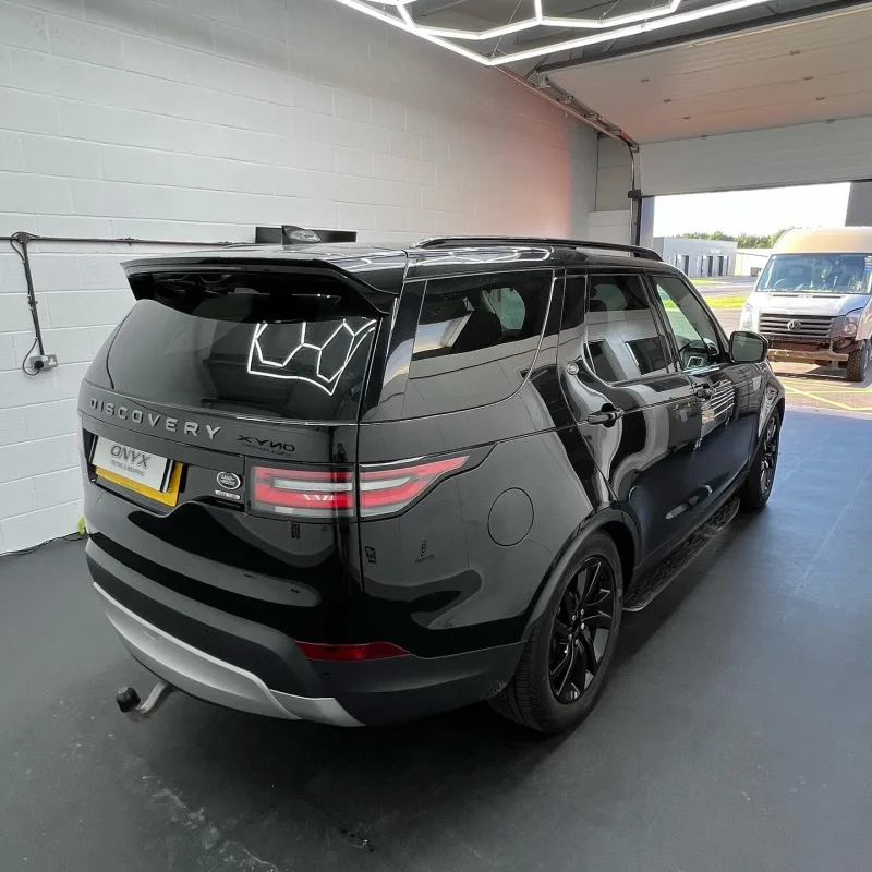 Black Land Rover Discovery Sport with 15% tinted rear windows