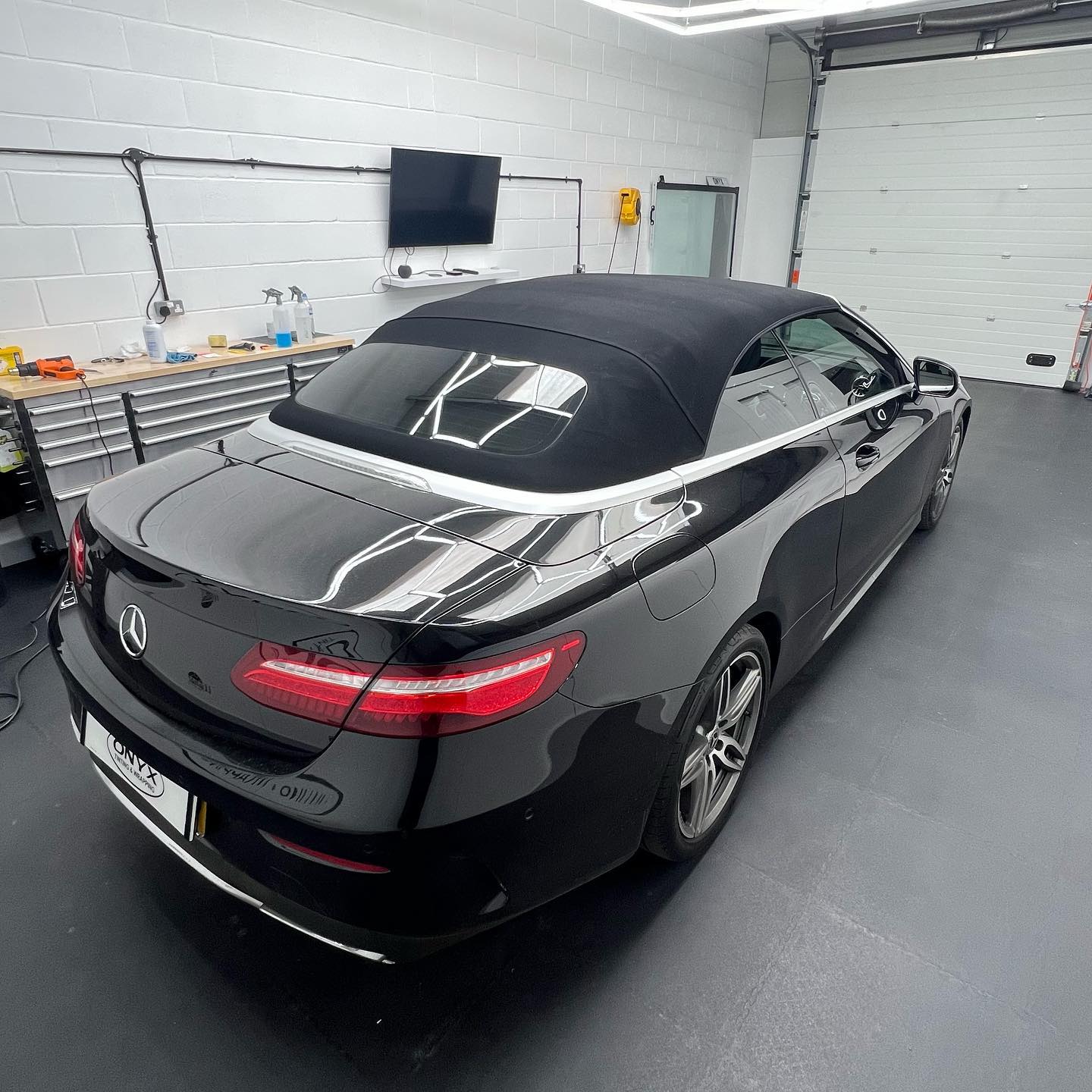 Black Mercedes-Benz E-Class A207 cabriolet with 35% rear window film