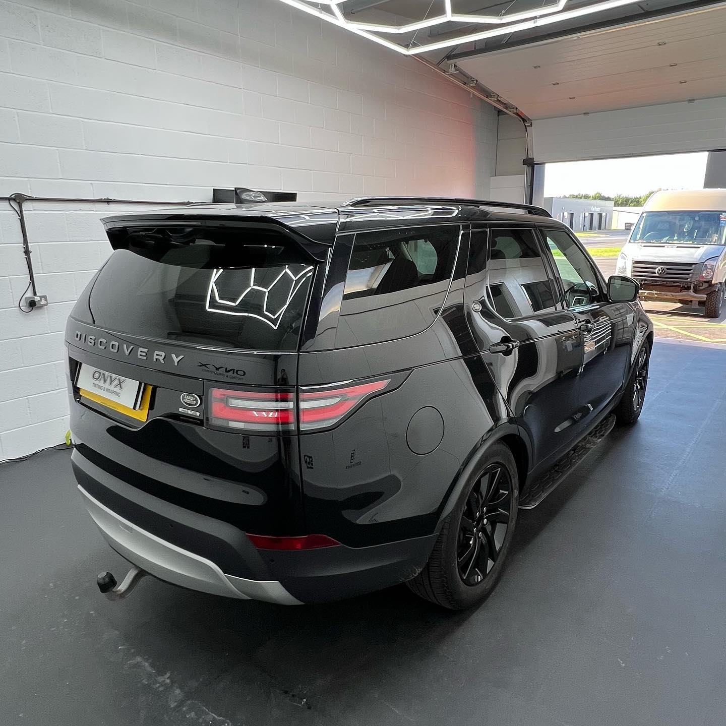 Black Land Rover Discovery Sport with 15% tinted rear windows
